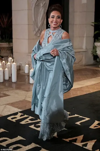 A Night of Opulence and Elegance: Melania Trump's Shimmering Silver Gown Steals the Spotlight at Mar-a-Lago's New Year's Eve Celebration