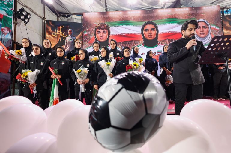 Between Celebration and Controversy: Iran's Female Footballers Return Home Under Regime Scrutiny