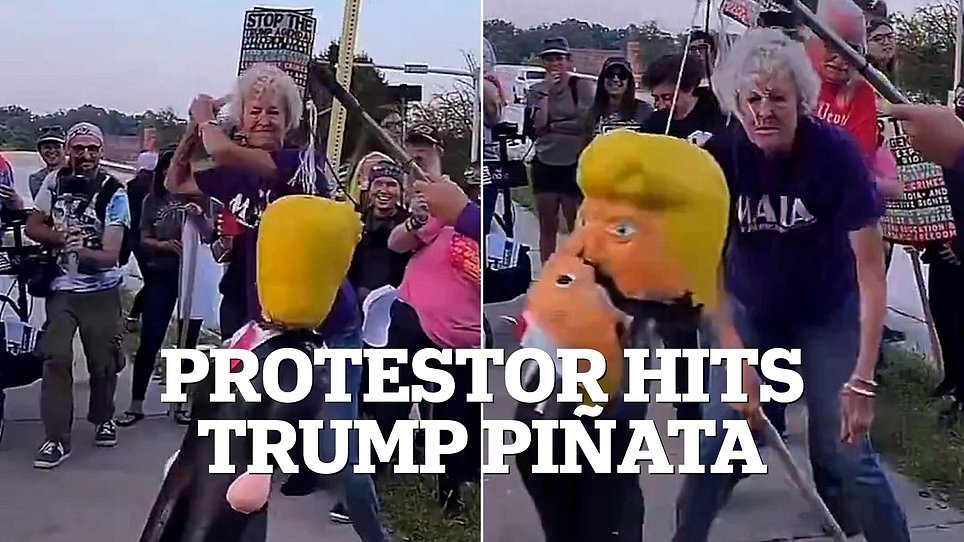 Protester wearing kindness shirt smashes piñata of Trump with pipe.