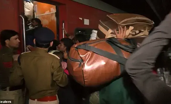 Crowds Crammed on Delayed Trains at Indian Train Station, Causing a 'Stampede' That Left at Least 15 People Dead