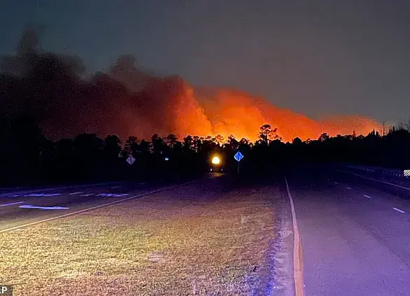 Wildfires rage across North and South Carolina, forcing evacuations and threatening homes